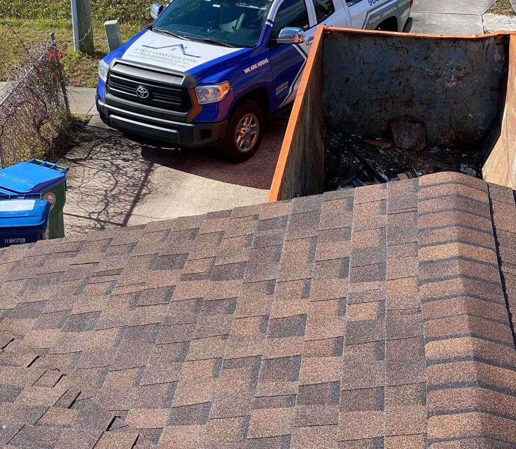 View of the A to Z Construction car from the roof of a house